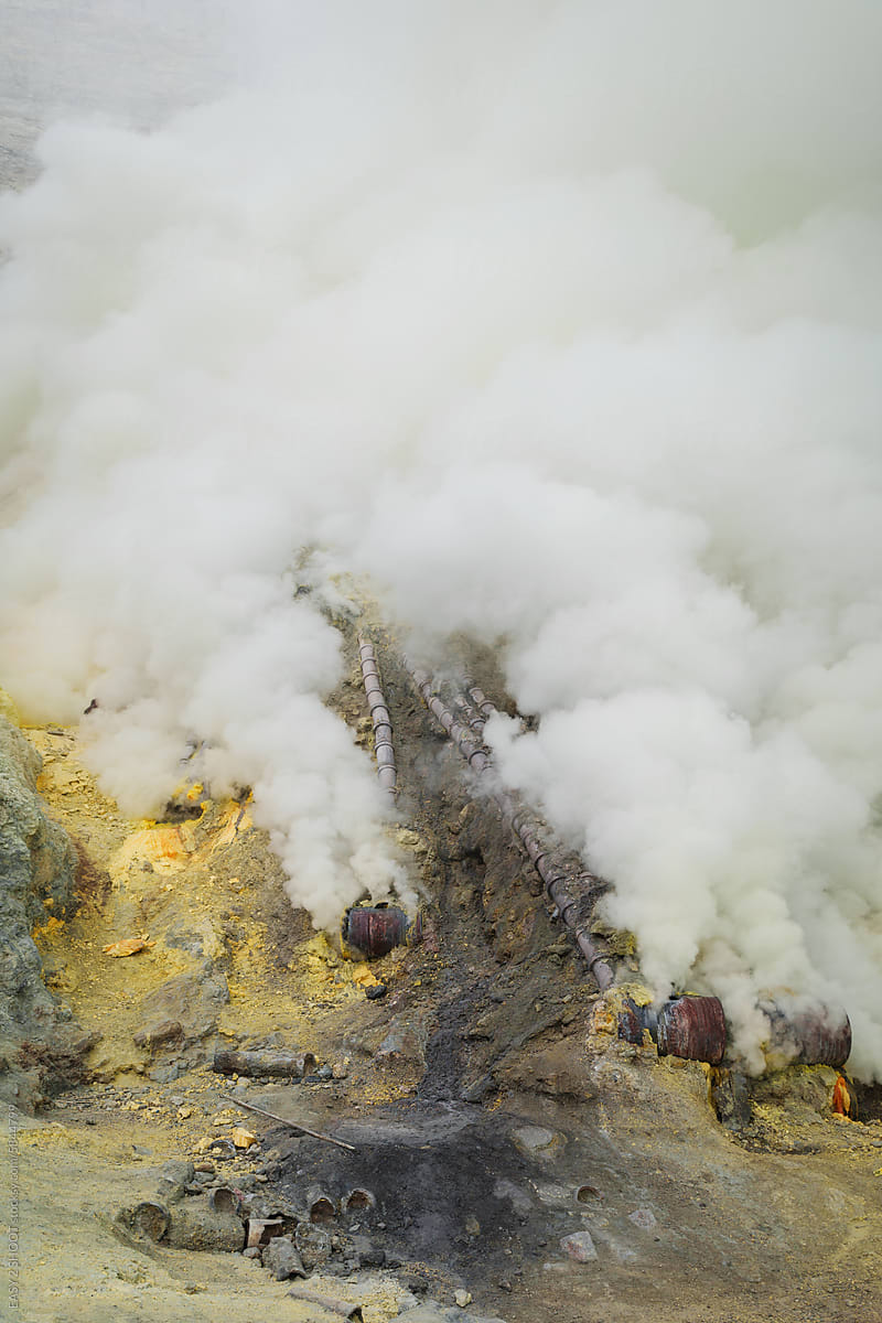 Sulfur open mine in an active volcano crater, toxic gas and ore