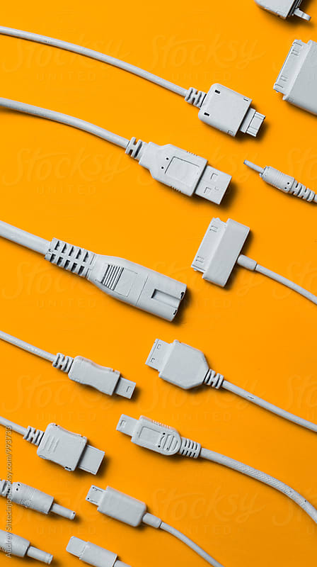 Various cable jacks and plugs on orange background