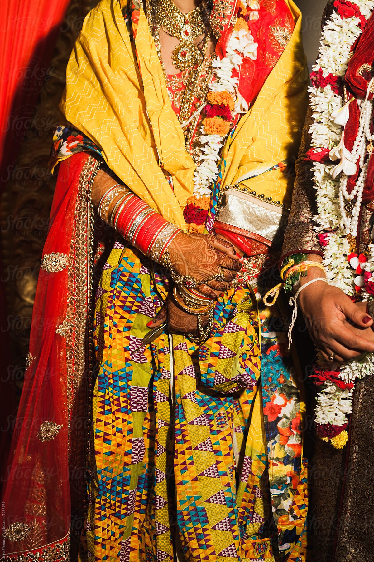 Detail shot of Bride and Groom\'s hands at an Indian wedding ceremony