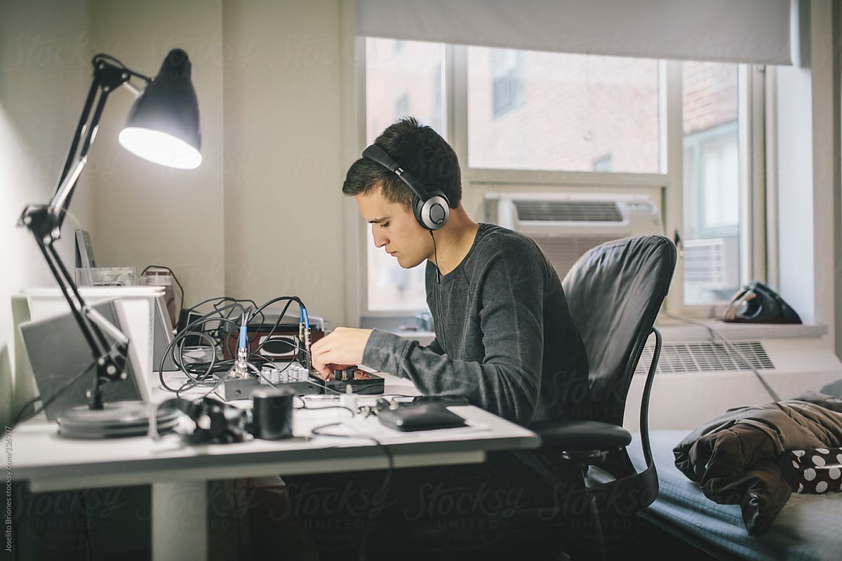 Young Mexican-American Male Student Using Beats-Generator to Create Music as Hobby