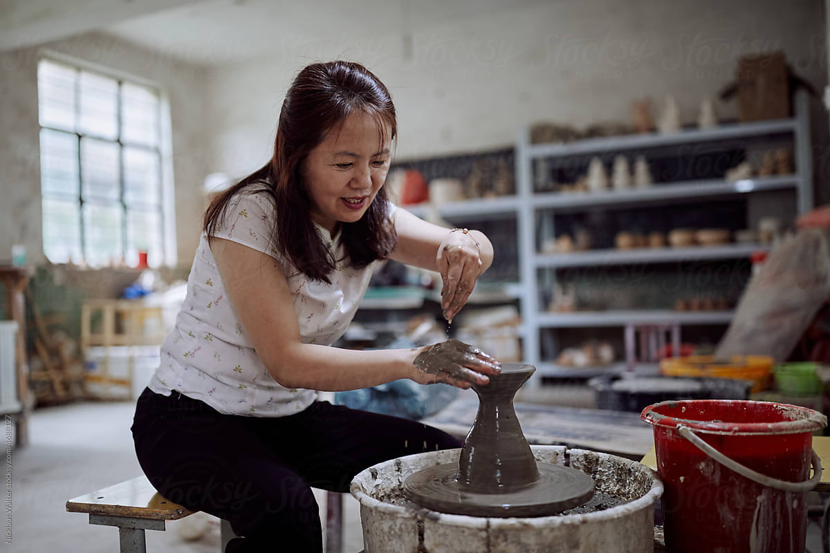 East Asian Small Business Owner Creates Pottery In Her Workshop