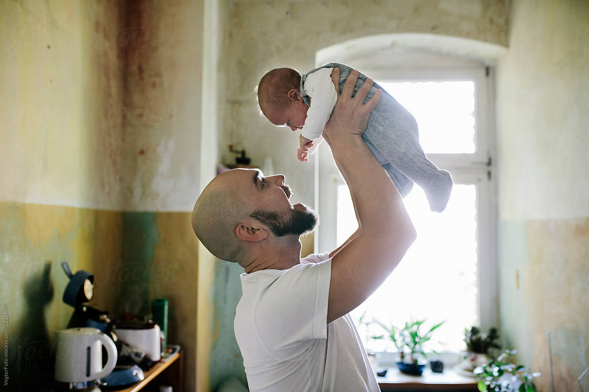Father lifting baby son