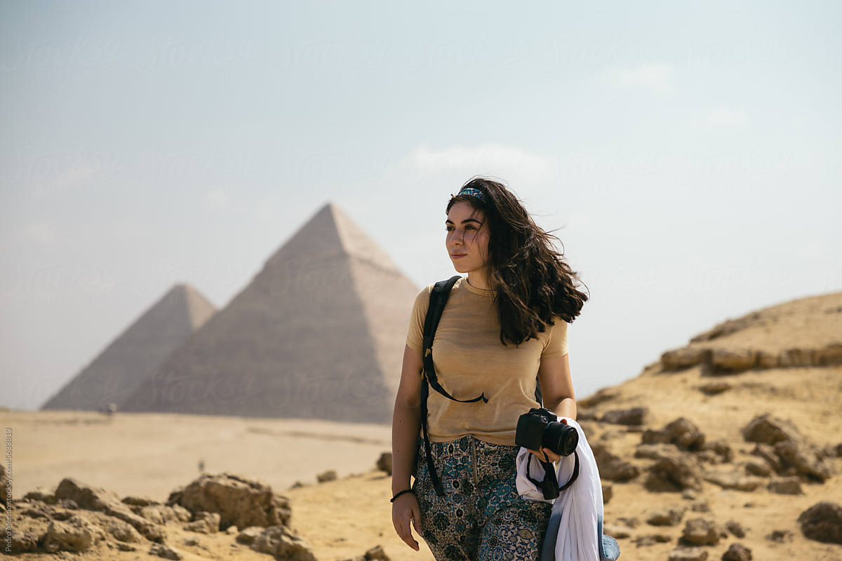 Woman visiting the pyramids of Egypt.