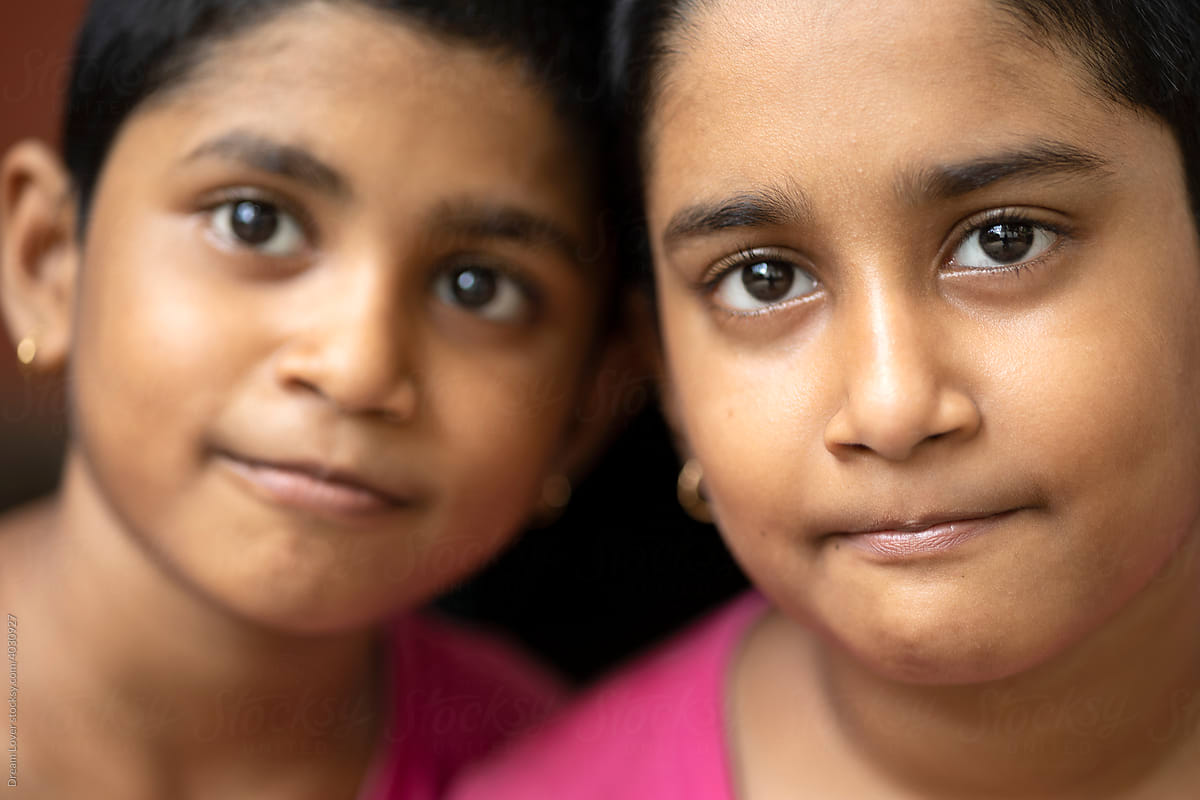 Close of portrait of Indian twin sisters together