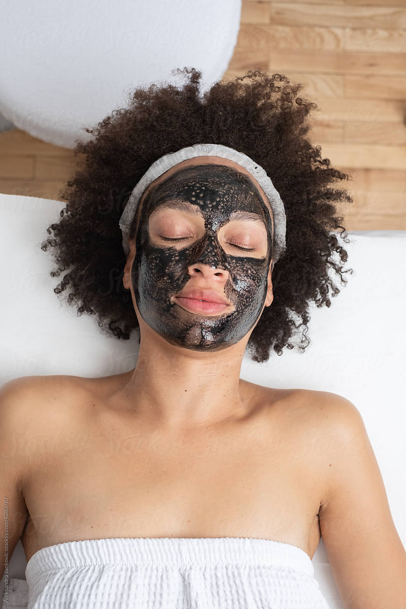 Woman With Carbon Mask On Her Face Relaxing