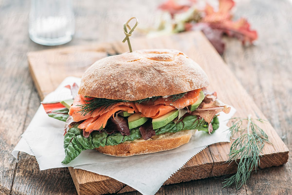 Food: smoked salmon sandwich with avocado,lettuce,card and dill