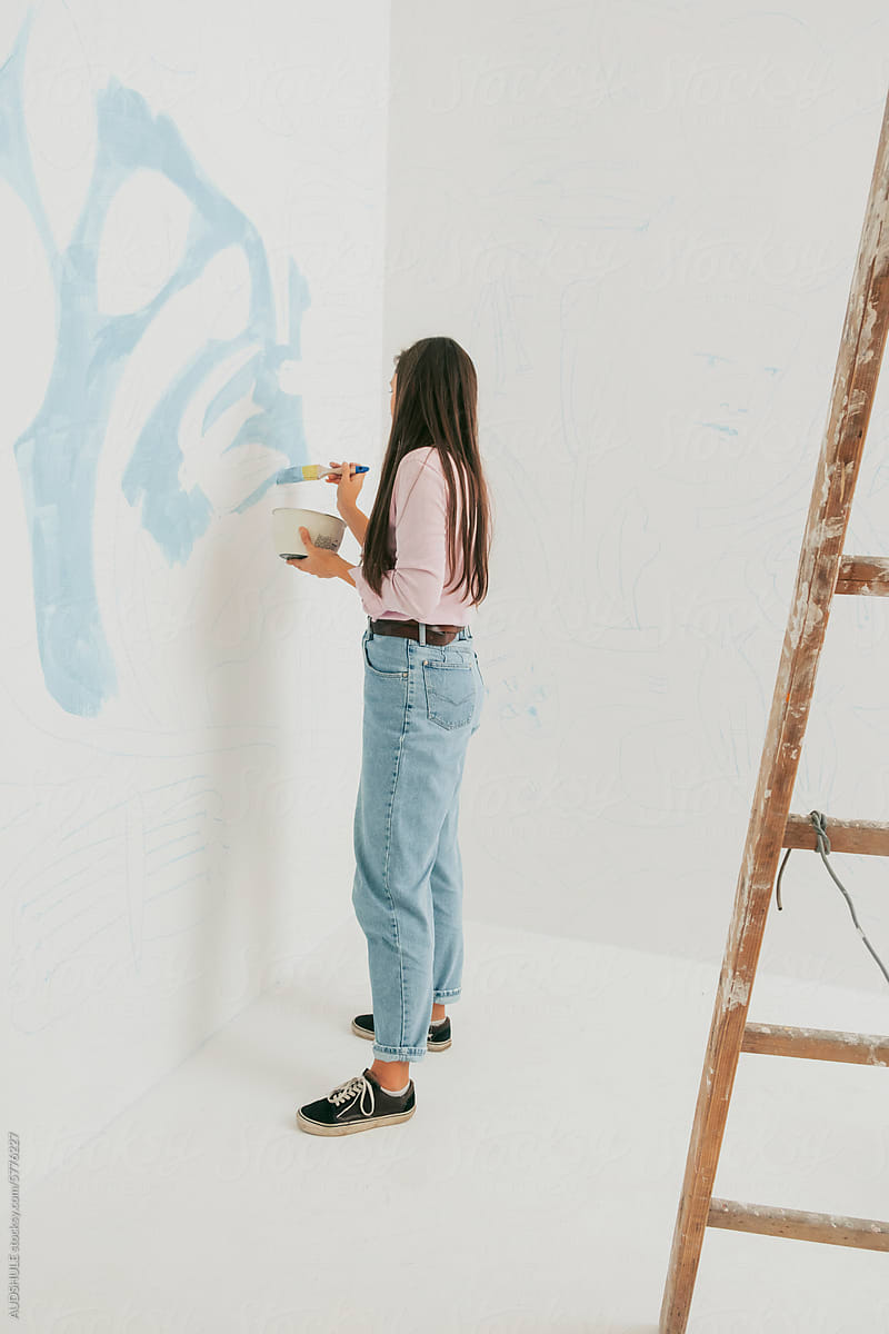 Artist working in her studio .