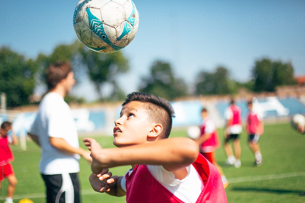 Boy Juggling a Soccer Ball