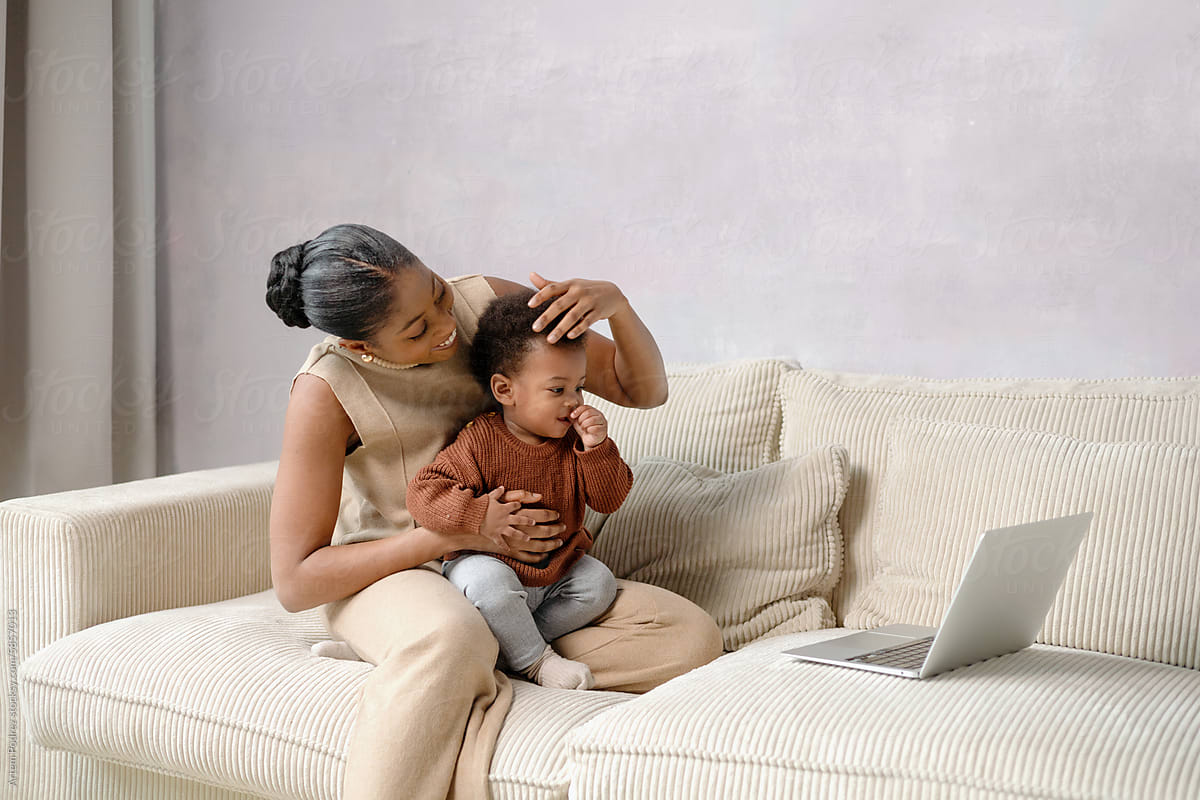 Mother and Child Enjoying Laptop Time at home