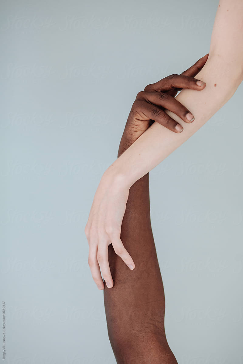 Hands of black man and white woman