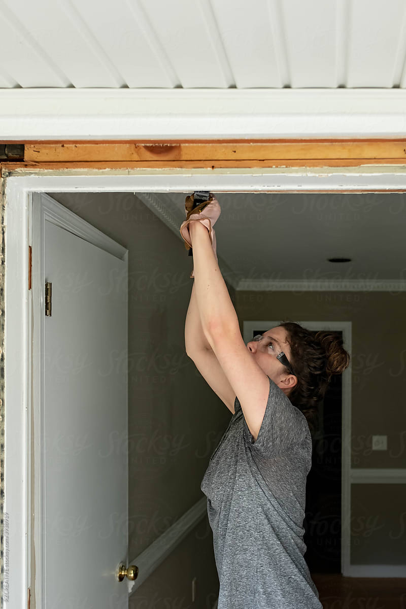 Woman remodeling her home.
