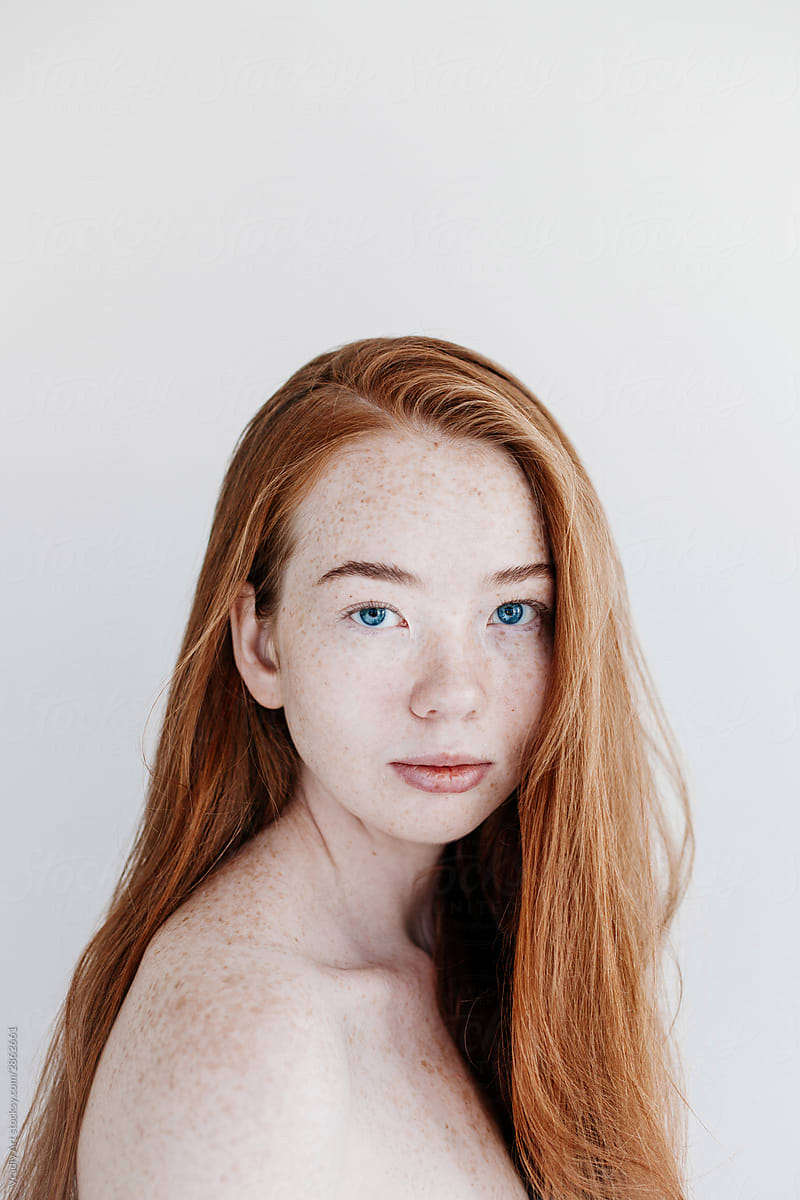 Topless redhead young woman with freckles