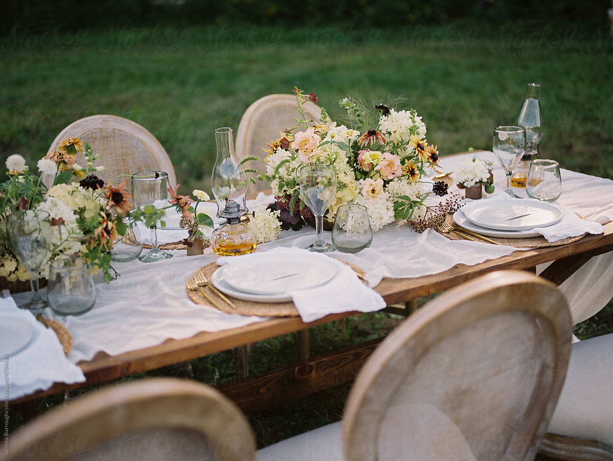 close up of wedding reception table setting with flower arrangements