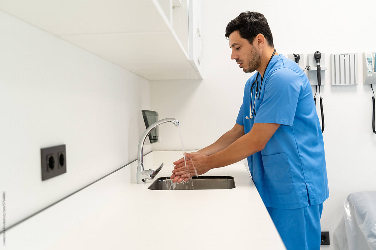 a doctor washing hands in the operation room at hospital