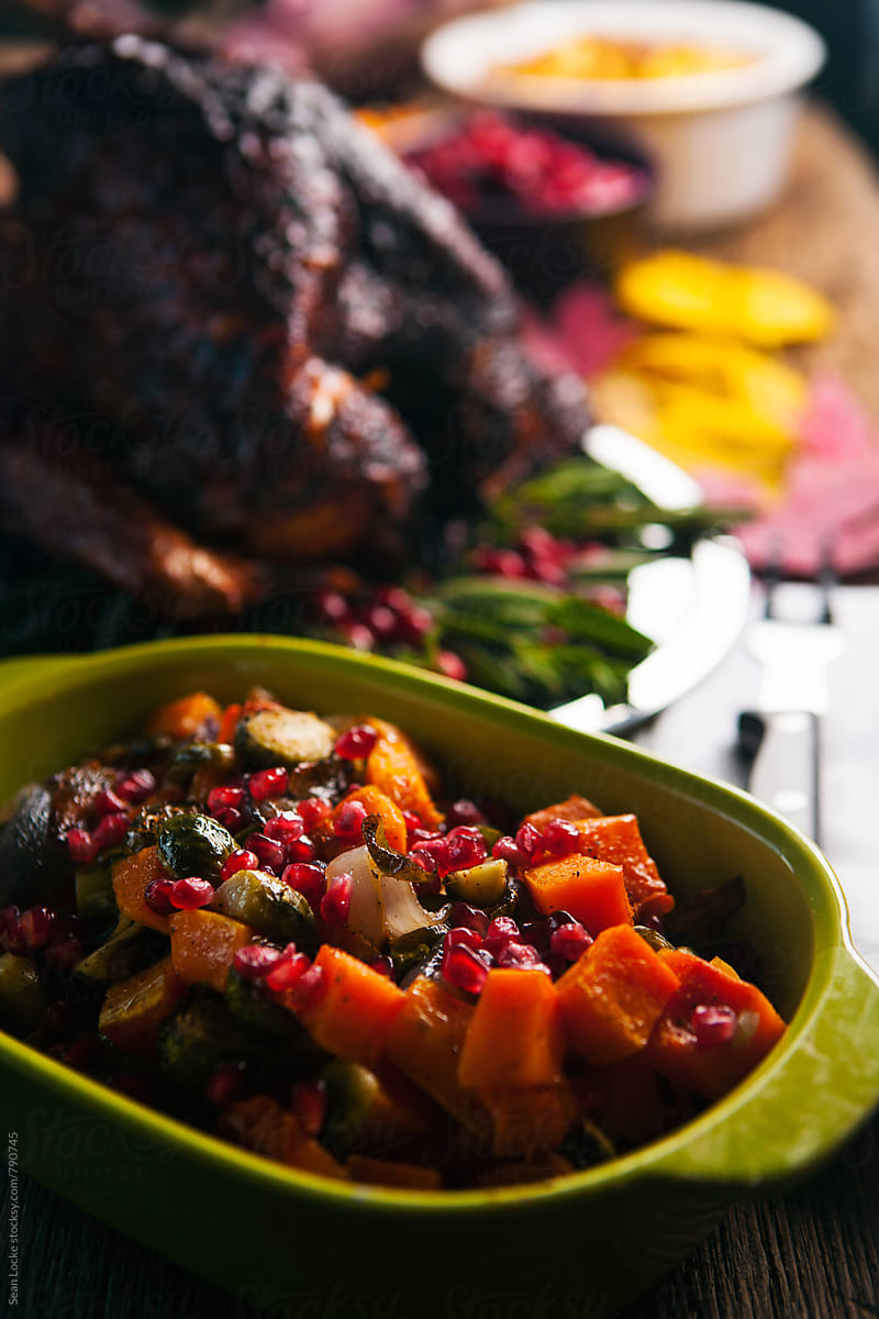 Thanksgiving: Focus On Roasted Vegetables Topped With Pomegranate Seeds