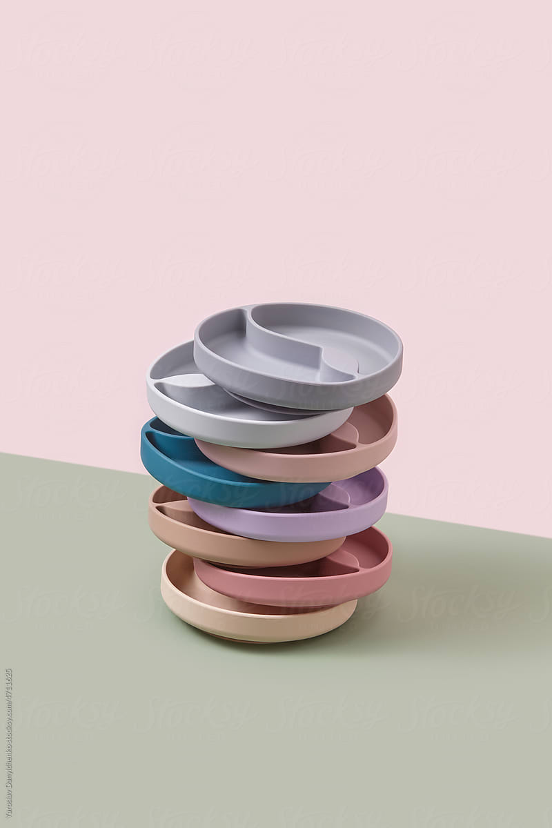 Stack of pastel colored silicone kids plates