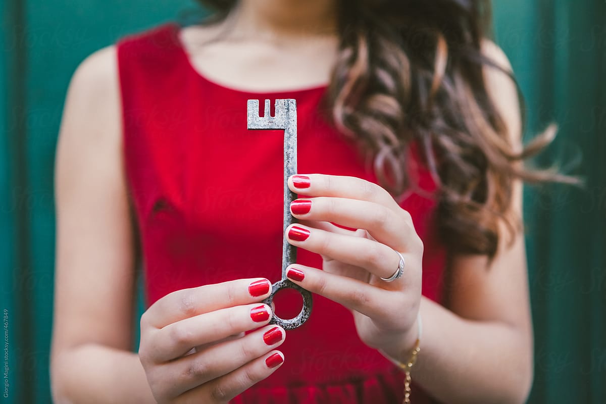 Young Woman Holding the Secret Key