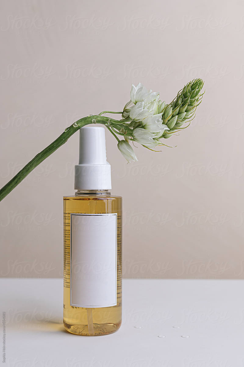 Still life of beauty product with flower