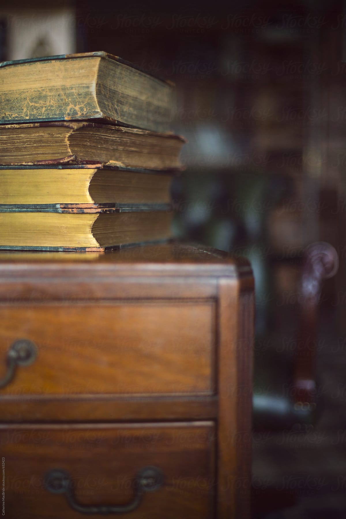 Old books on a wooden desk...