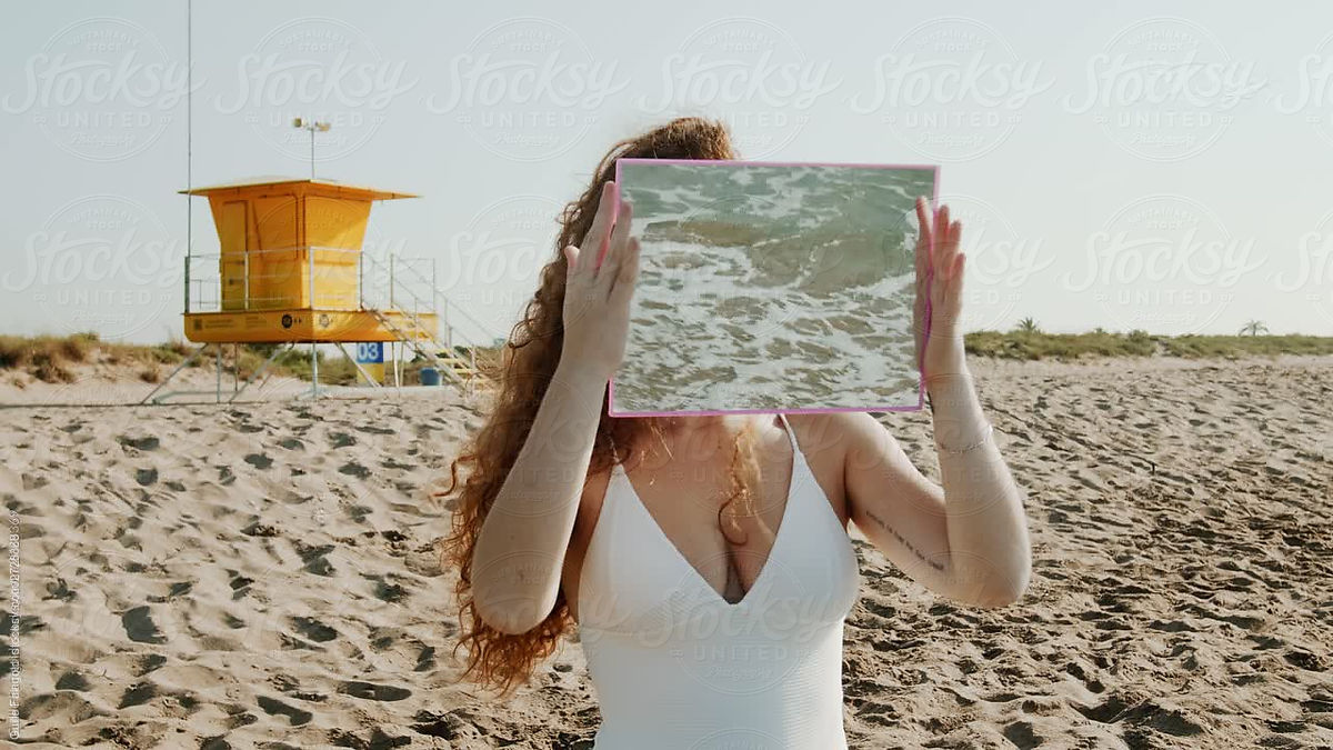 Girl In Swimsuit Holding Mirror Reflecting Sea Tide By Stocksy Contributor Guille Faingold 