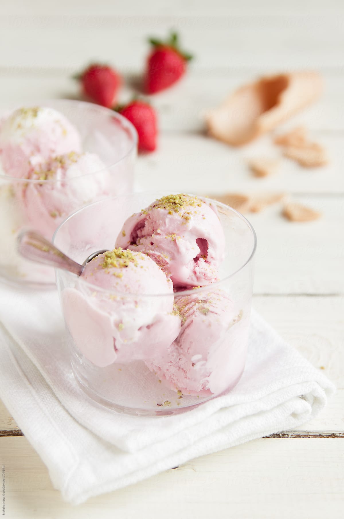 Strawberry icecream with pistachio topping