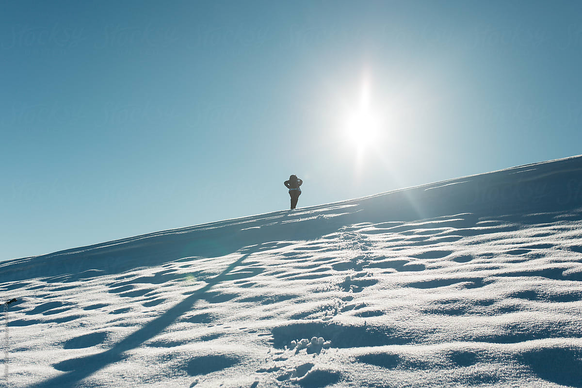 Female hiker in snow cover mountain