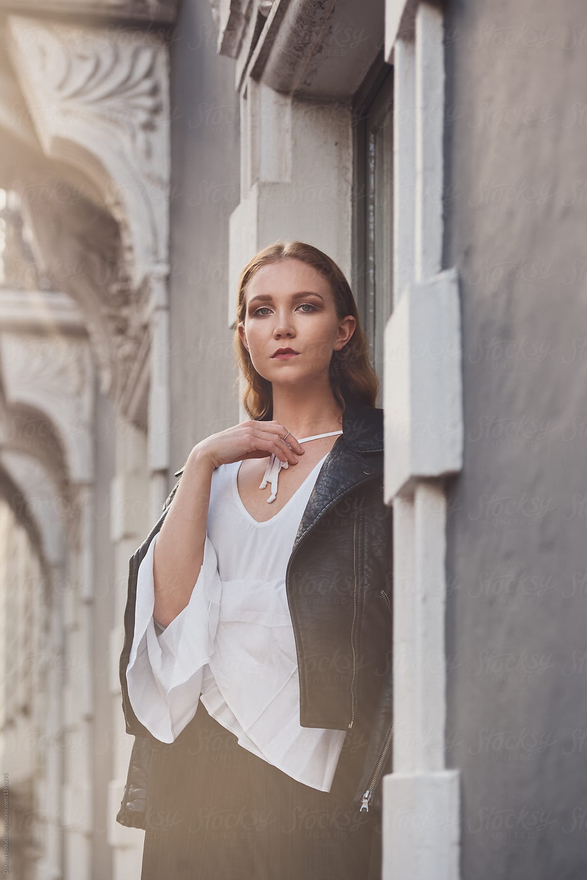 Stylish young woman portrait in european city