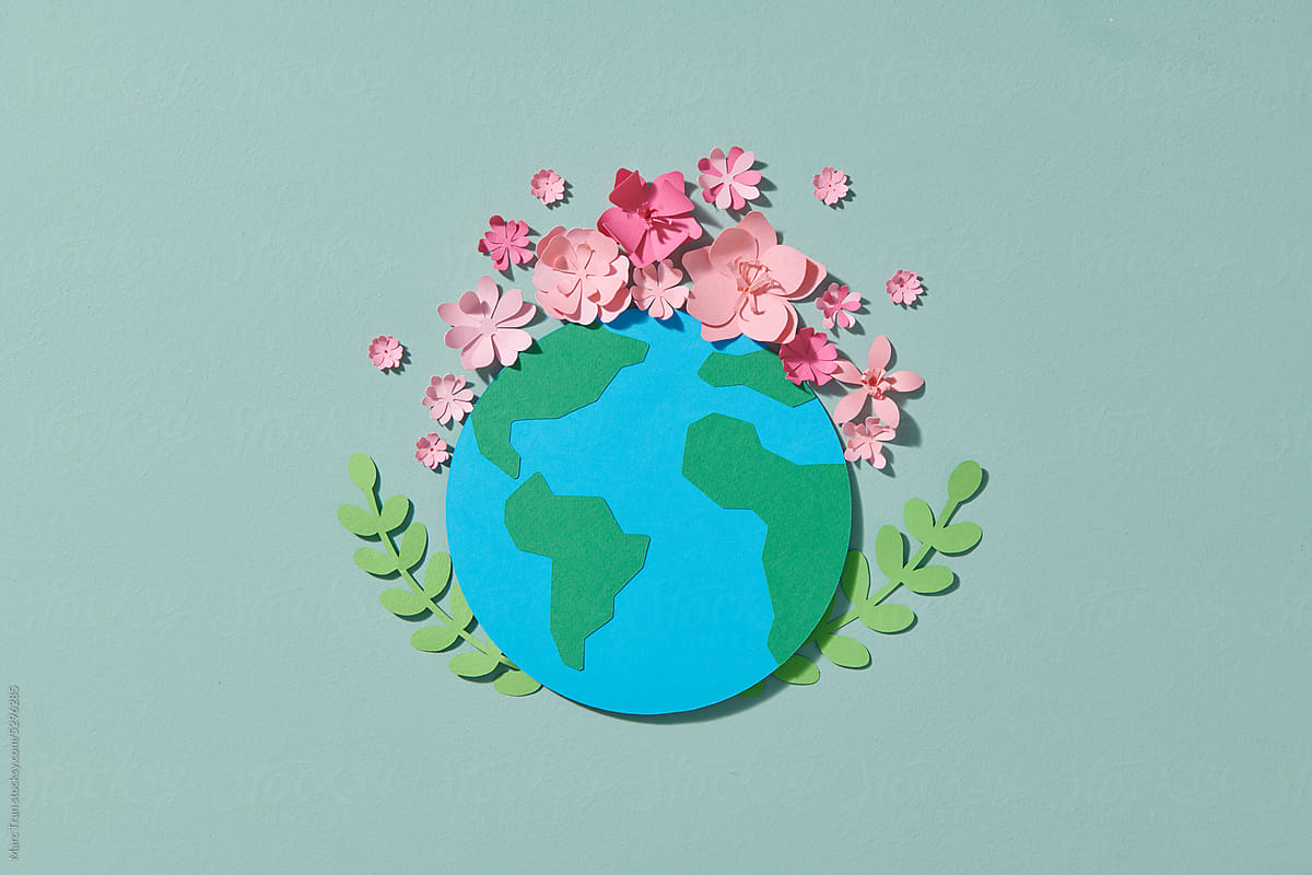 Planet Earth model papercraft on natural background.