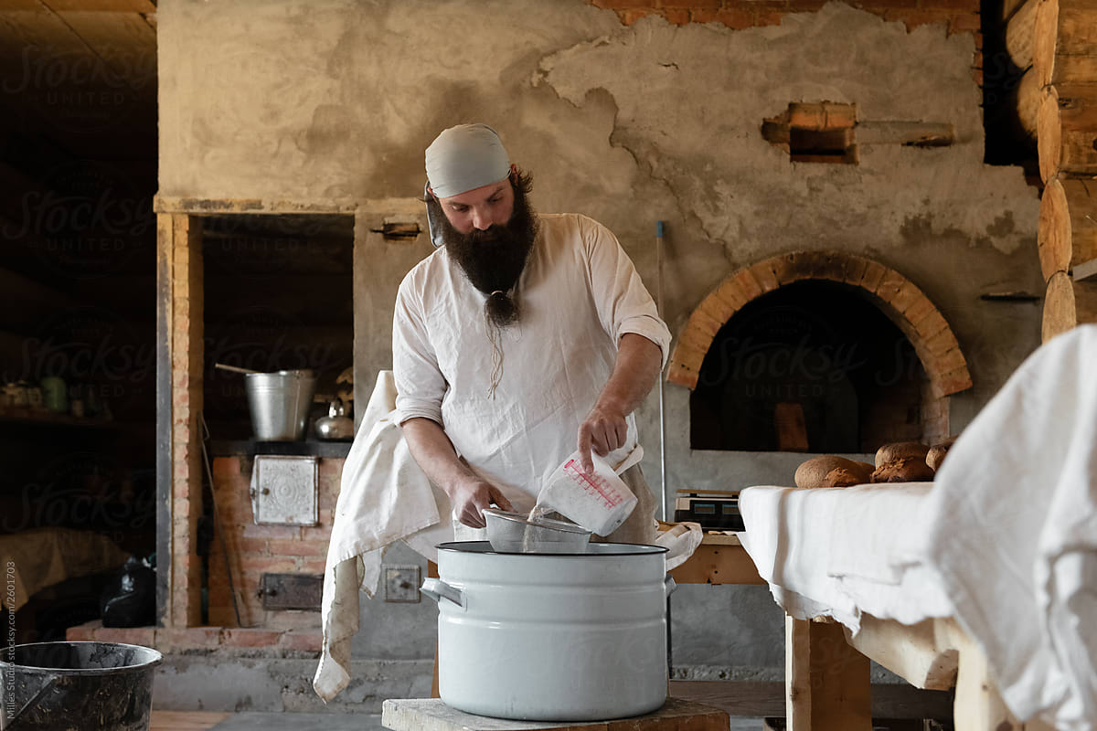 Man preparing bread in country workshop