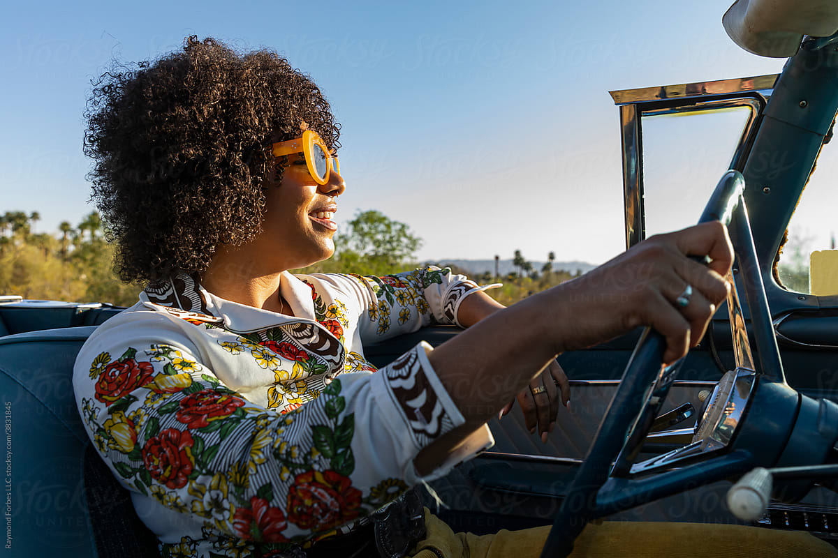 Portrait of Stylish African American girl driving car