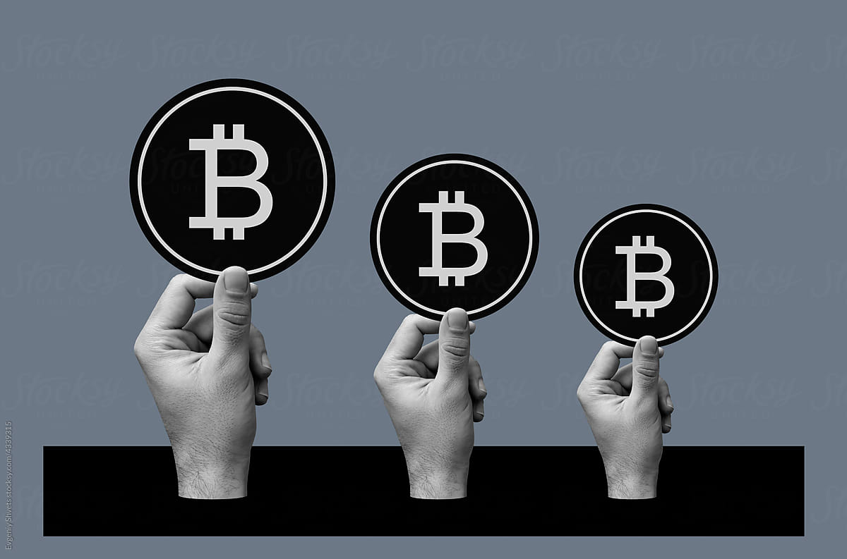 Group of Hands Holding Bitcoins