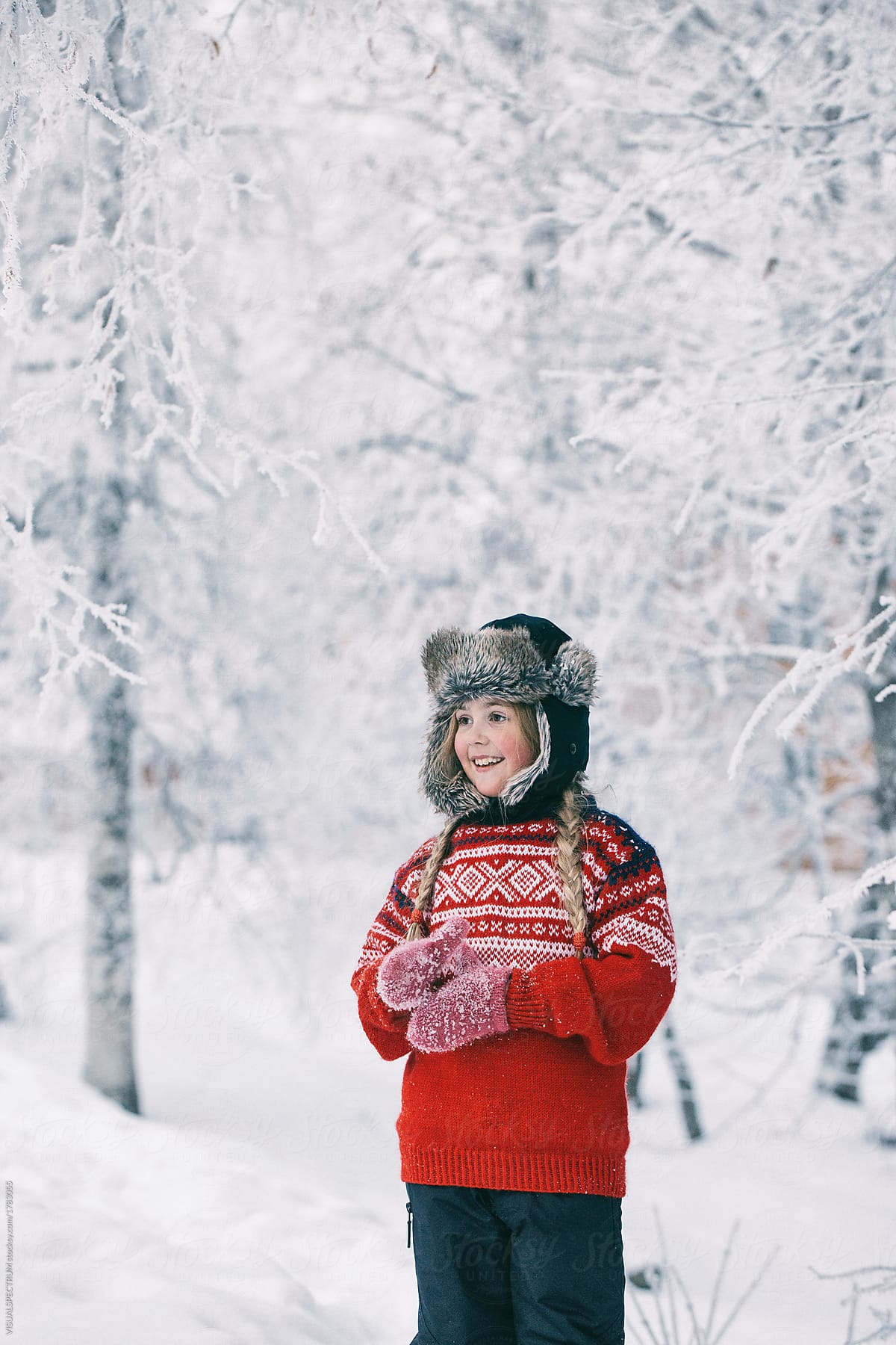 Outdoor Winter Portrait of Cute Norwegian Girl Standing Among White Trees