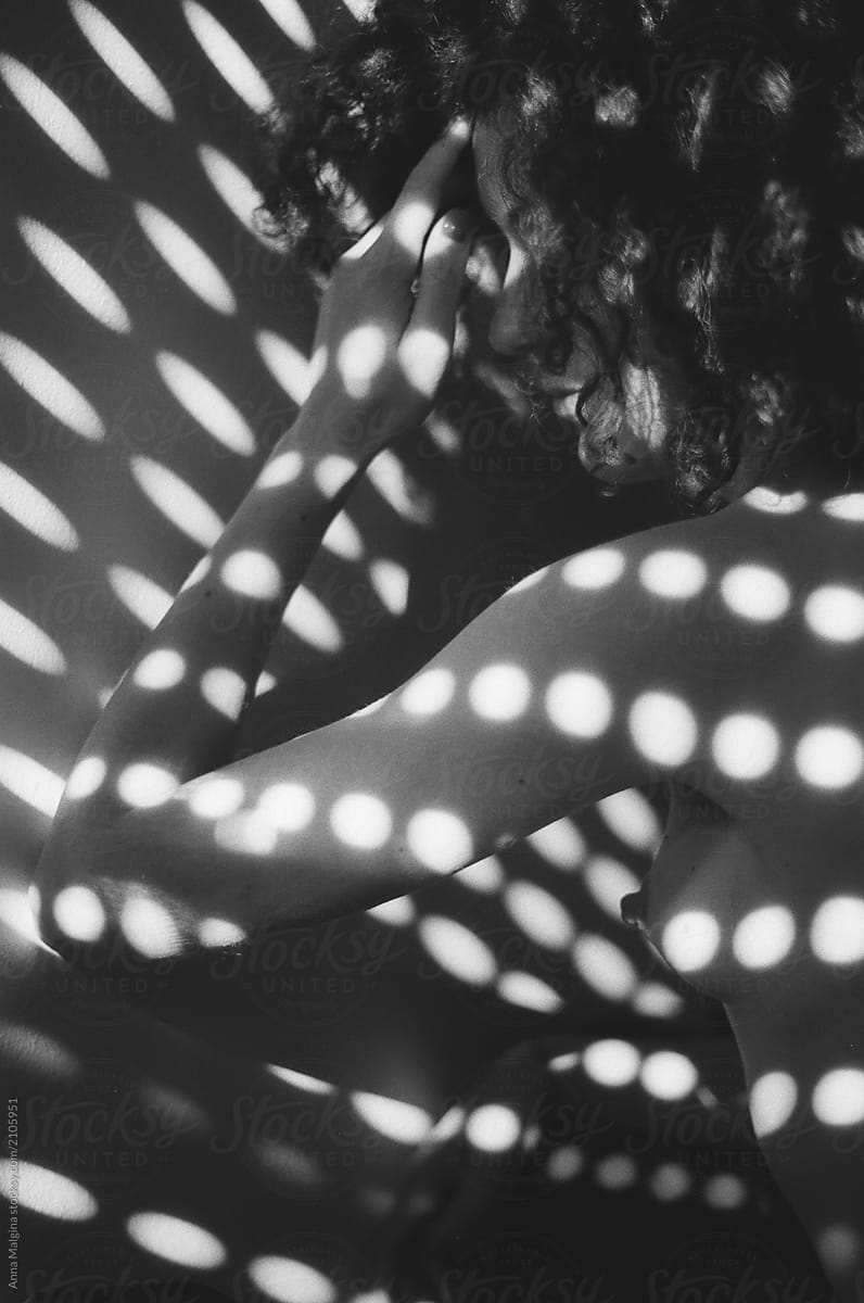 A woman with shadow dots on her body