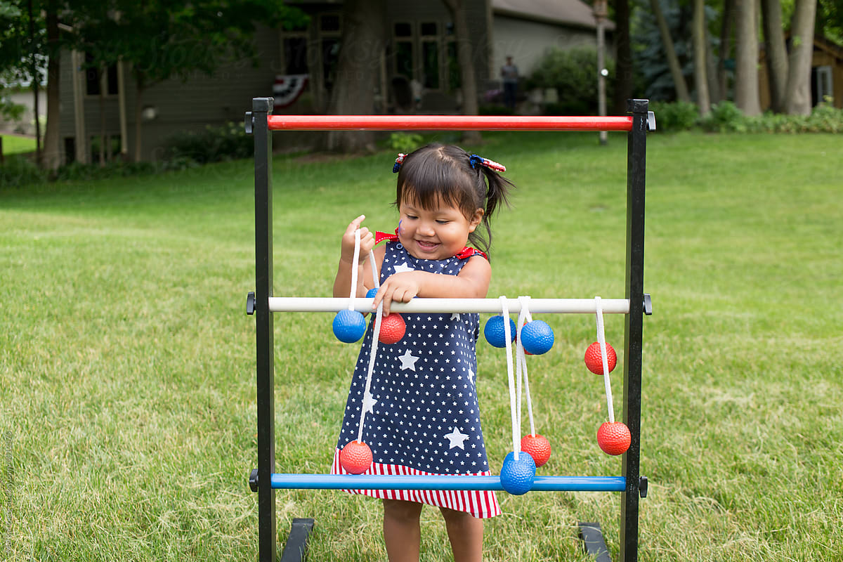 Young girl playing ladderball