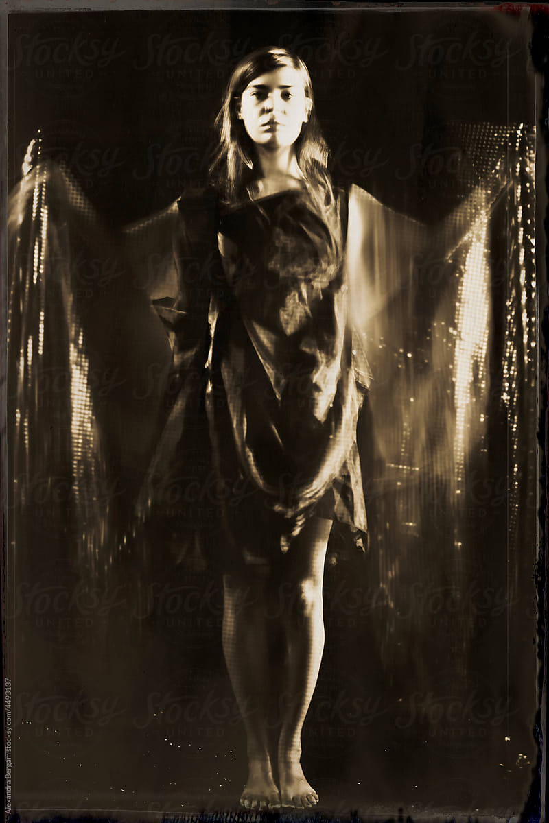 Abstract woman with golden wing dress