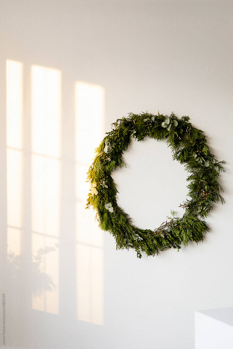 Sunlit Holiday Wreath on Wall
