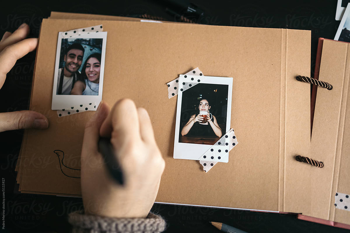 Woman Making A Scrapbook With Polaroid Photos by Stocksy Contributor  Pedro Merino - Stocksy
