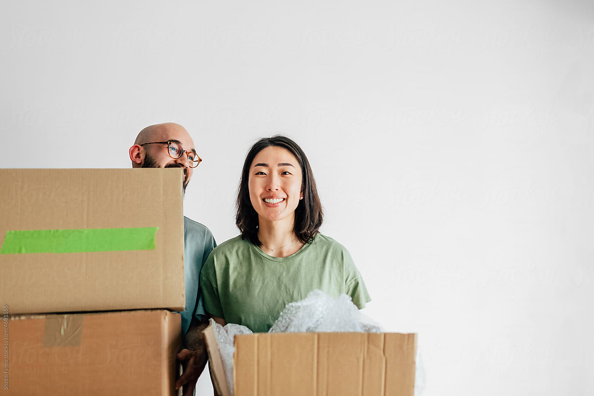 Man and Woman Moving into New Apartment