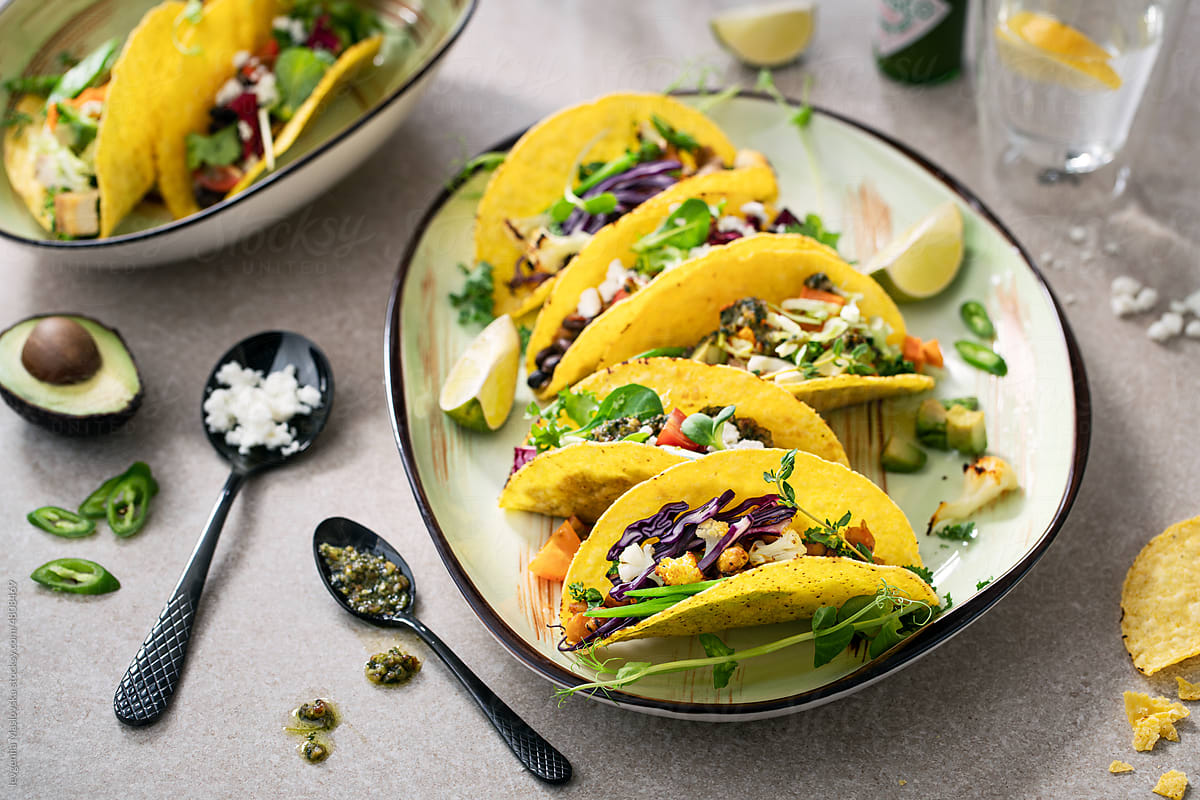 Healthy vegetarian tacos on a plate with ingredients