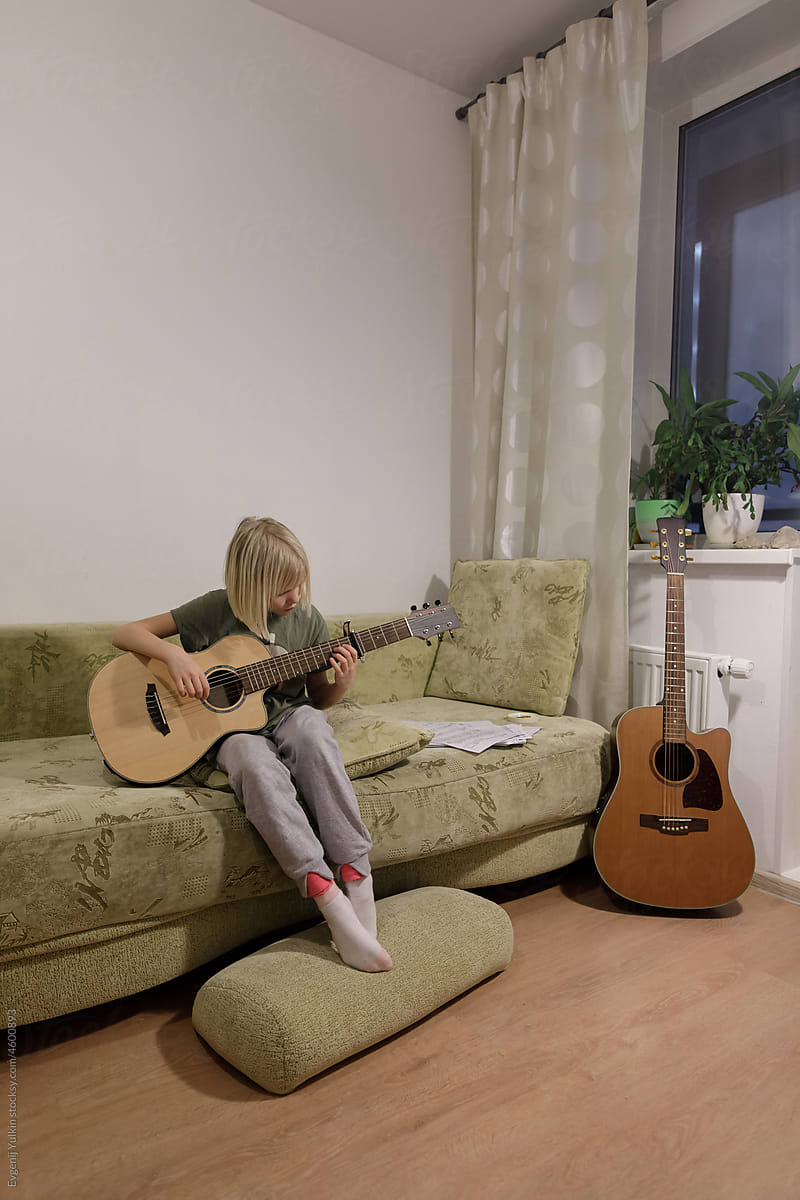 Playing guitar at home