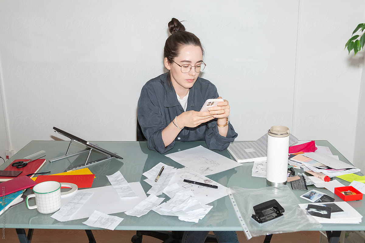 Office Worker Analyzing Invoices and Receipts on Smartphone