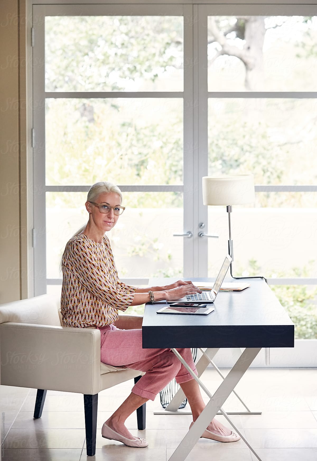 Portrait of mature businesswoman working in home office