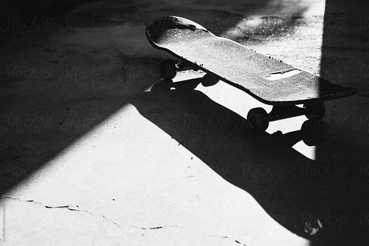 Skateboard in shadow