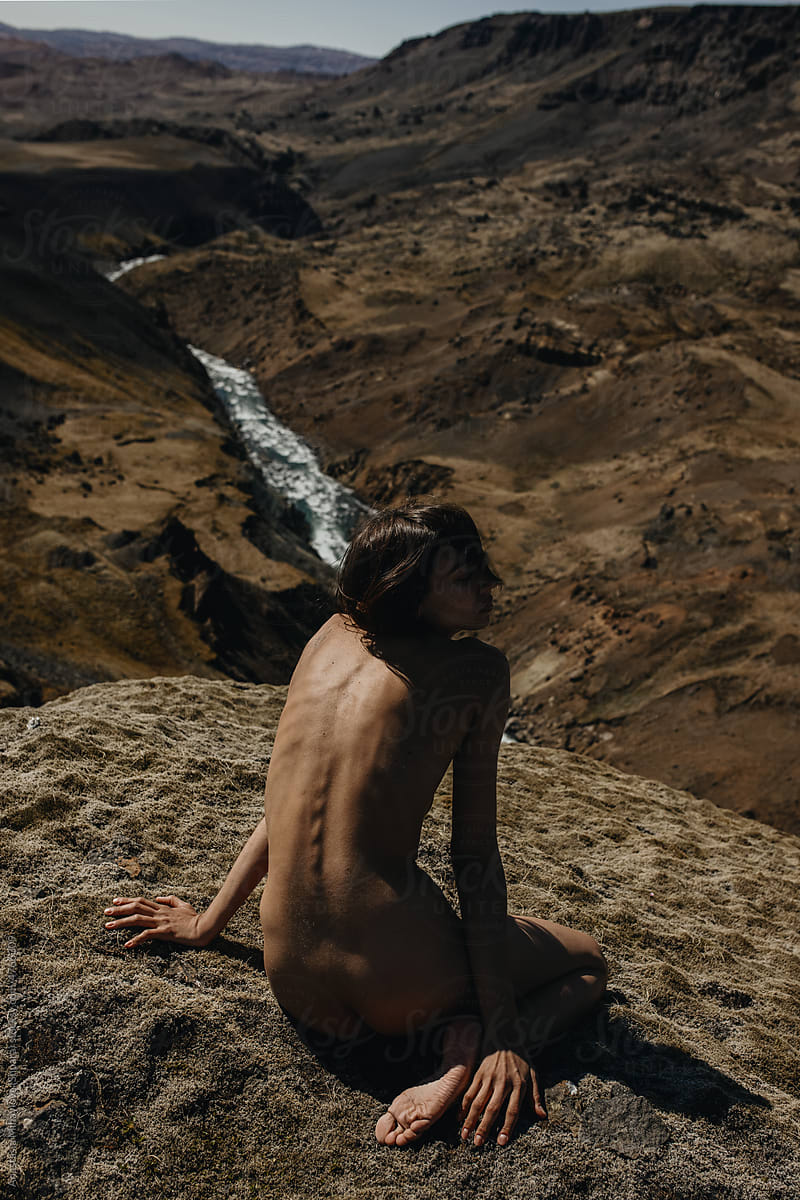 Portrait Of Naked Woman Sitting In Water by Stocksy Contributor