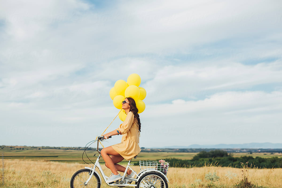 Happy Woman Riding a Tricycle