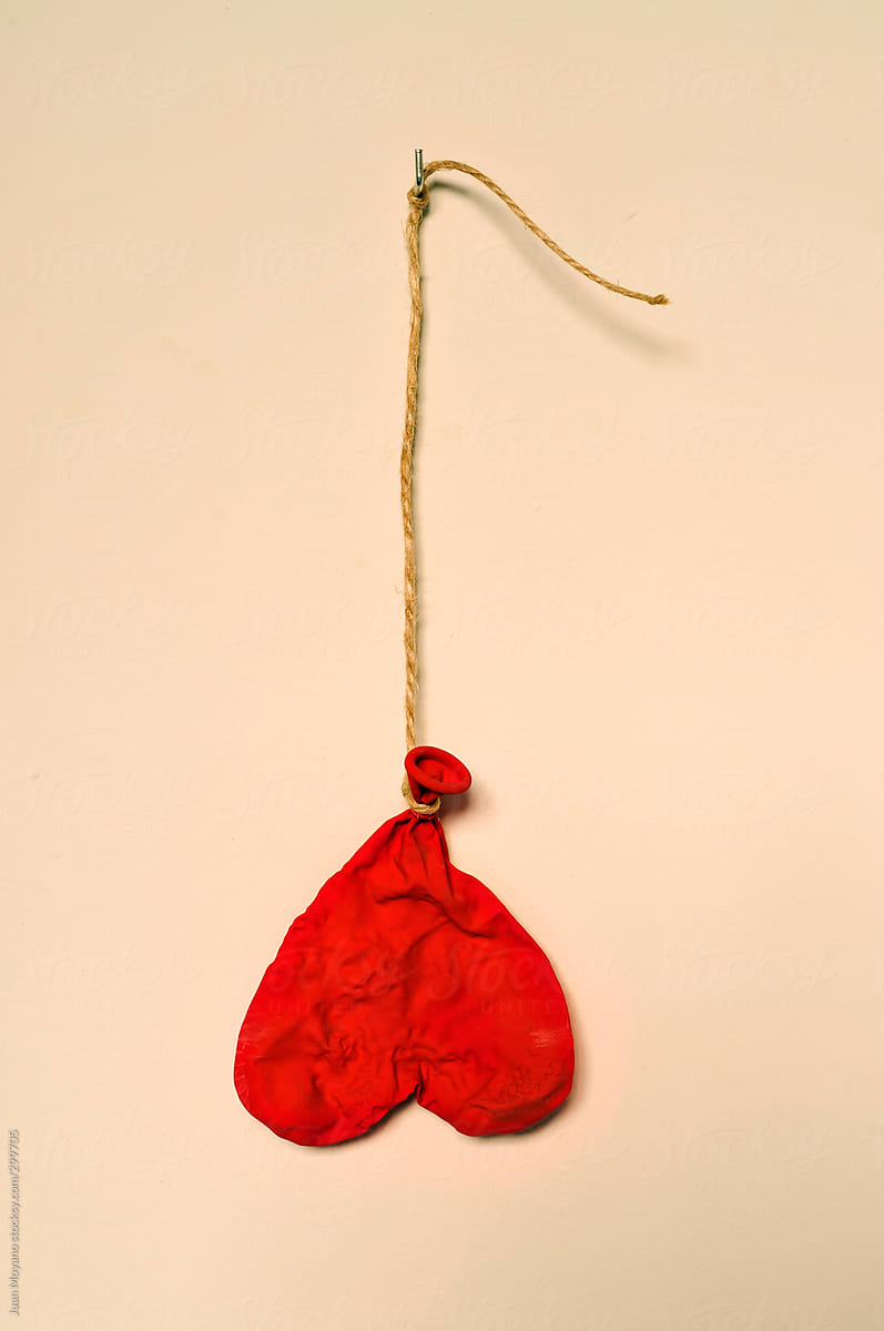 Deflated Heart-shapped Balloon by Stocksy Contributor Juan