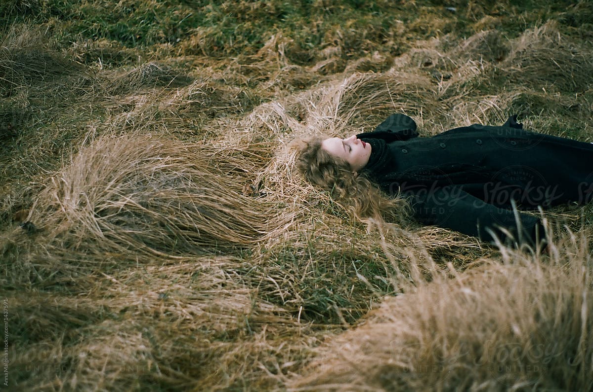 Woman Lying On A Grass By Stocksy Contributor Anna Malgina Stocksy