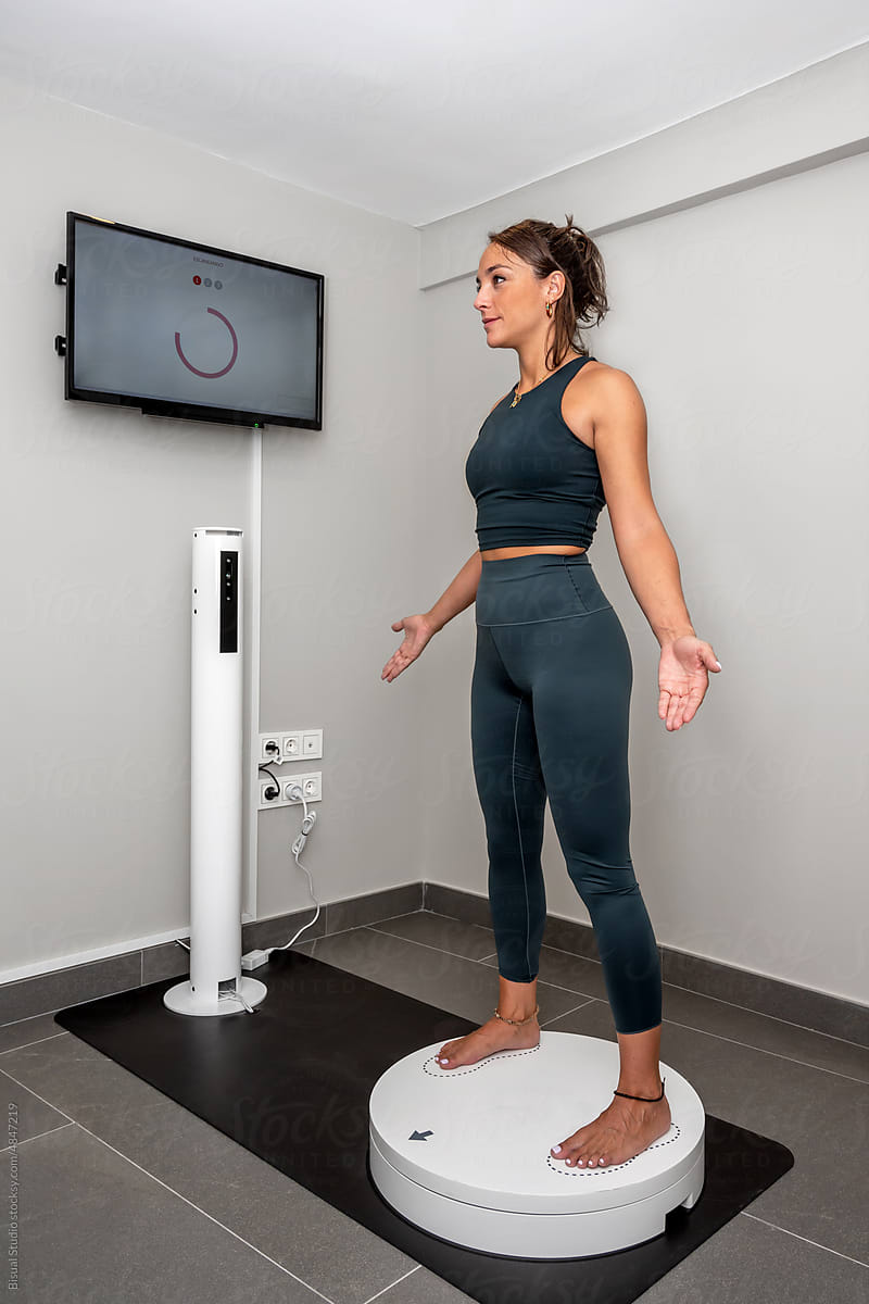 Sportswoman on 3D body scanner