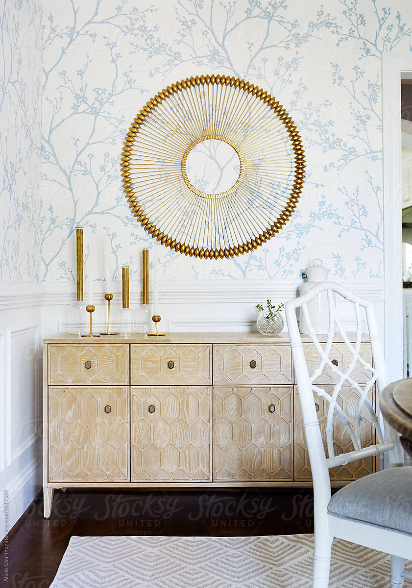 Dining room sideboard and brass wallhanging