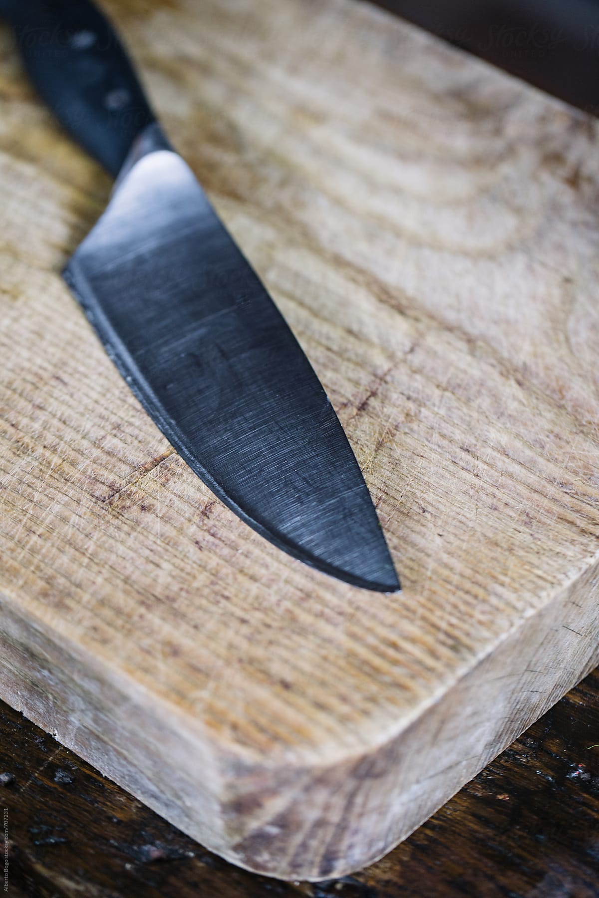 Knife on wooden cutting board